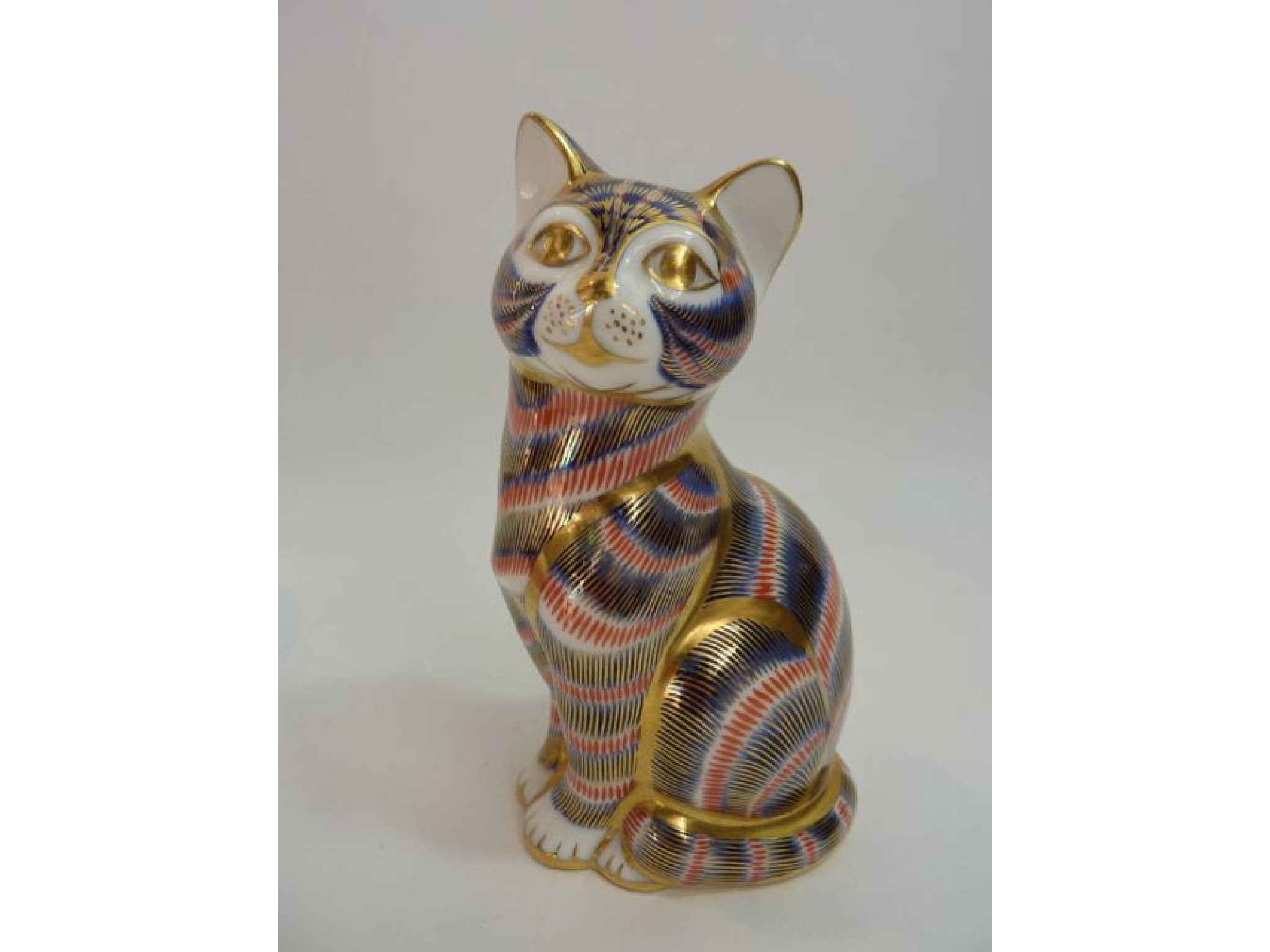 Appraisal: A Royal Crown Derby paperweight of a seated tabby cat