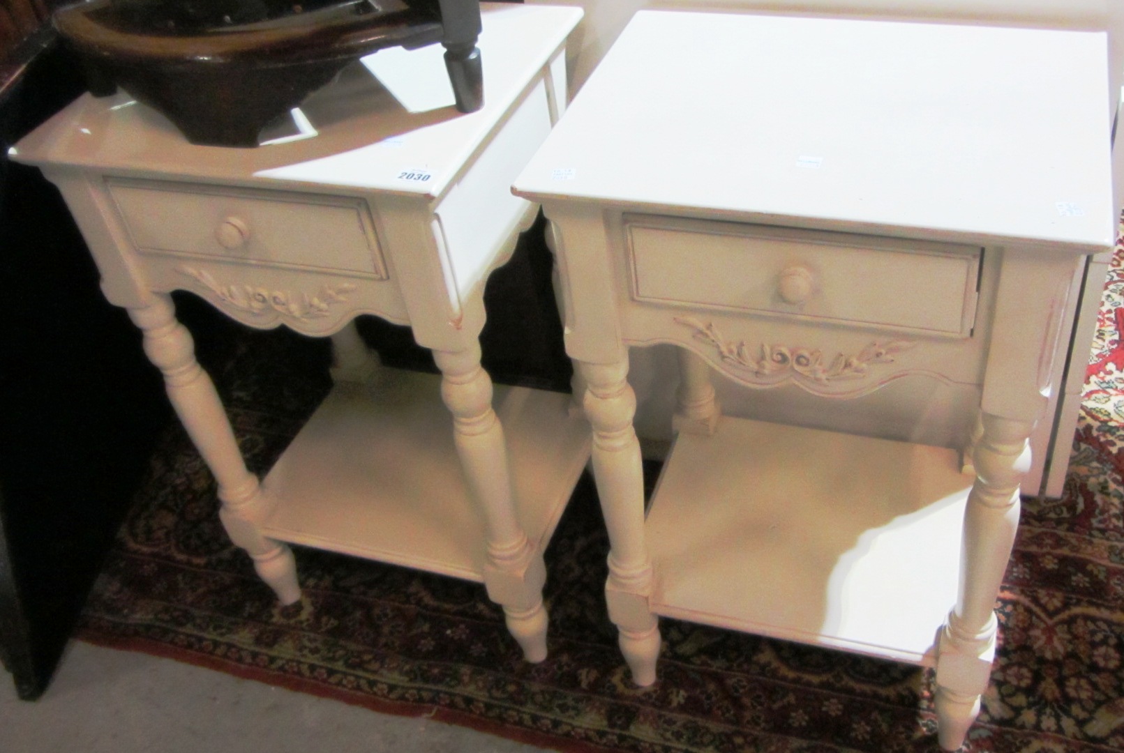 Appraisal: A pair of white painted bed side tables