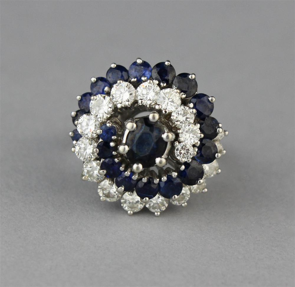 Appraisal: DIAMOND AND SAPPHIRE SWIRL COCKTAIL RING IN K WHITE GOLD