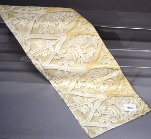 Appraisal: Cream on cream double faced wrought iron pattern silk scarf