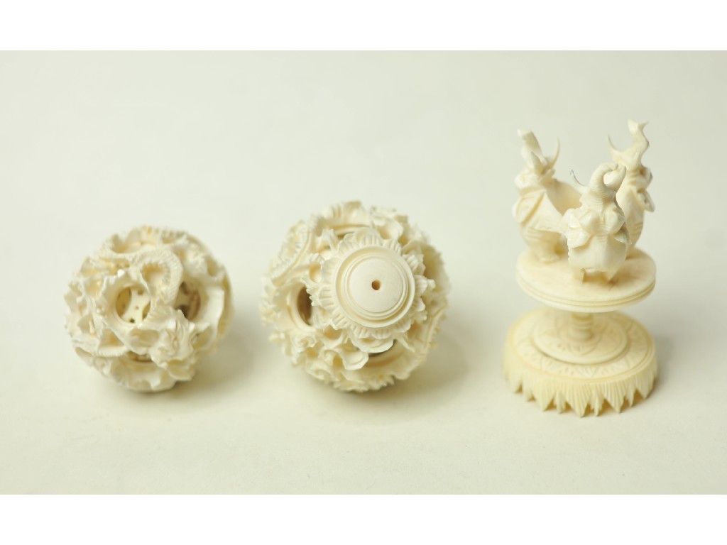 Appraisal: Lot comprising carved ivory puzzle ball on stand and another