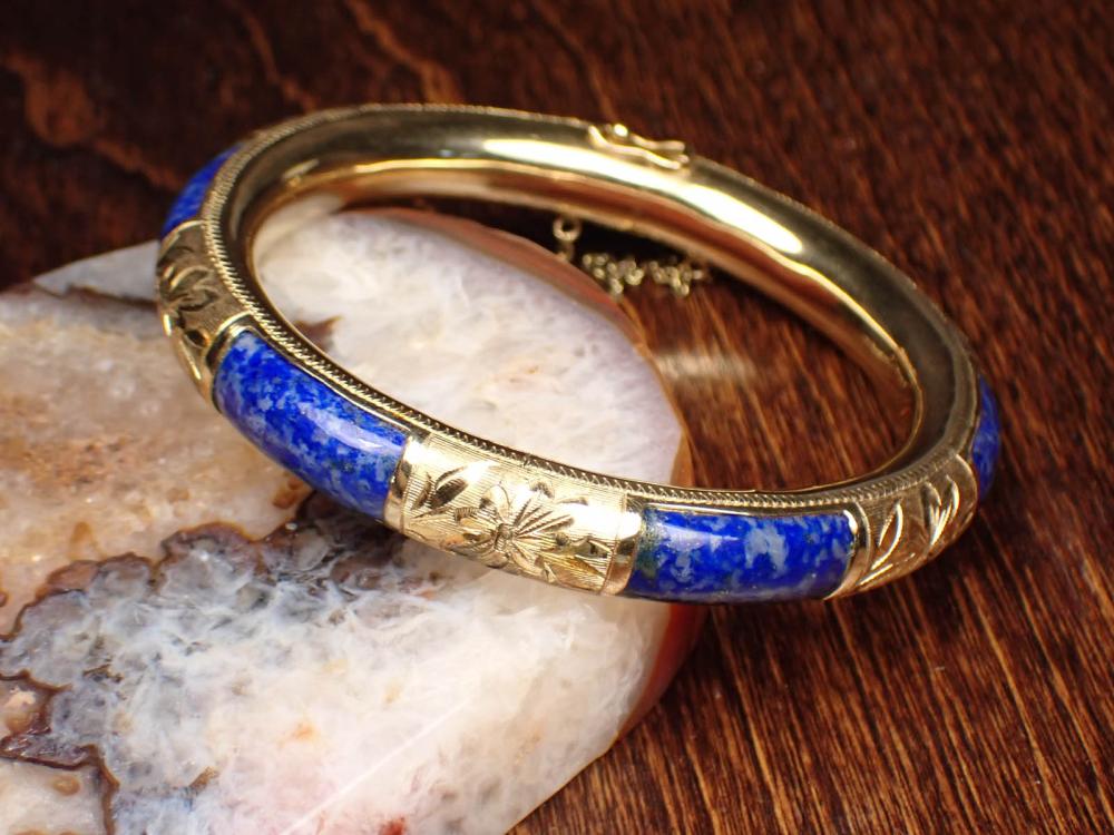 Appraisal: LAPIS LAZULI AND FOURTEEN KARAT GOLD BANGLE The k yellow