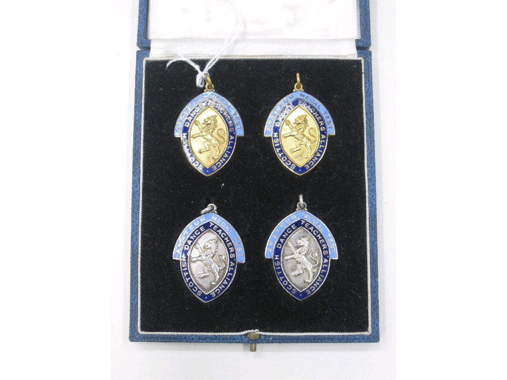 Appraisal: Cased set of four white metal and enamelled Dance Teacher's