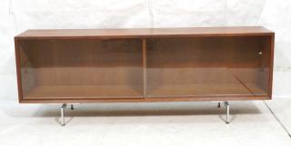 Appraisal: Low Horizontal form Teak Modern Credenza Sliding glass doors Extended