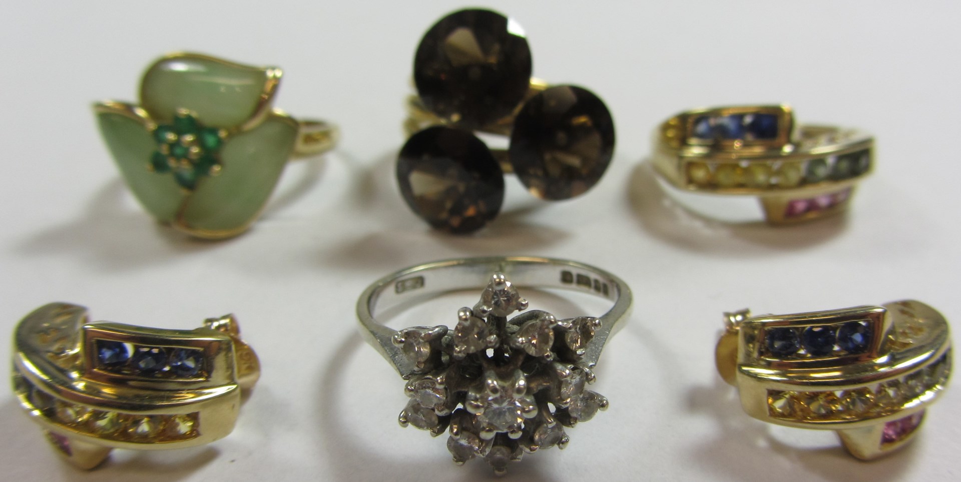 Appraisal: A ct gold and vary coloured gem set ring in