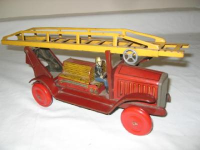 Appraisal: A tinplate fire engine with driver and extending ladder clockwork