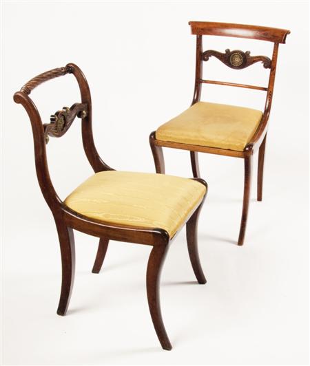 Appraisal: A pair of Regency mahogany side chairs each with rope