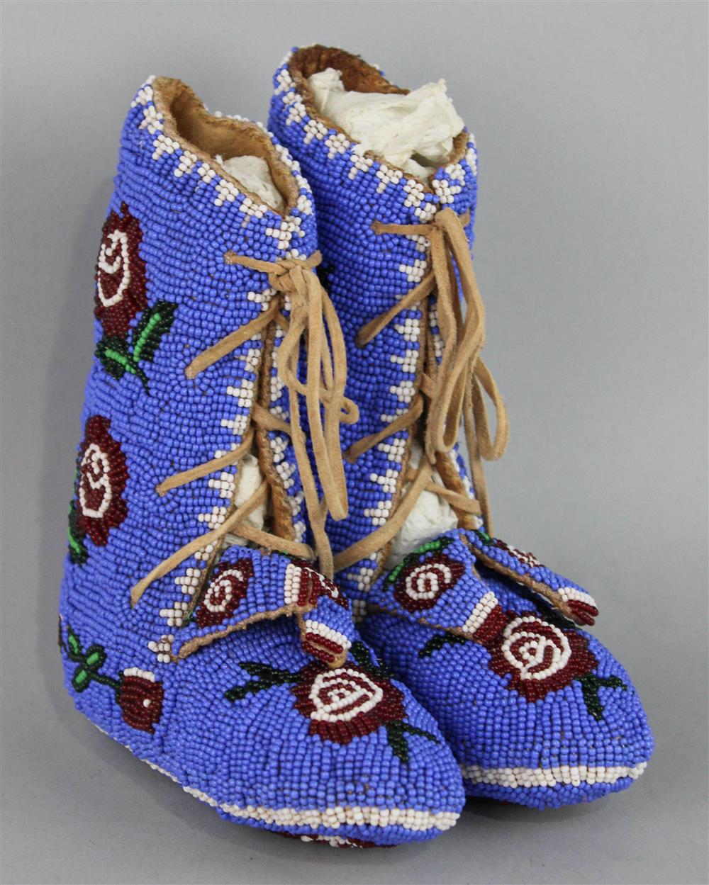 Appraisal: PAIR OF NATIVE AMERICAN CHILD'S BEADED HIDE MOCCASINS blue ground