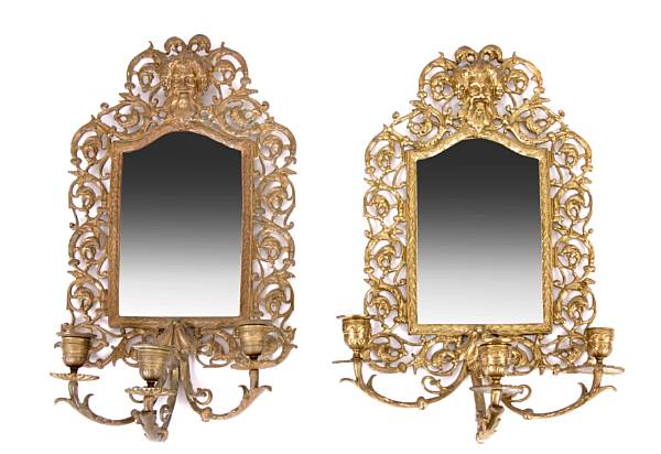 Appraisal: A pair of Italian Rococo style brass three light wall