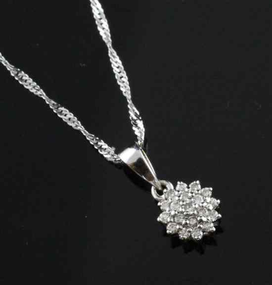 Appraisal: An ct white gold and diamond cluster pendant on ct