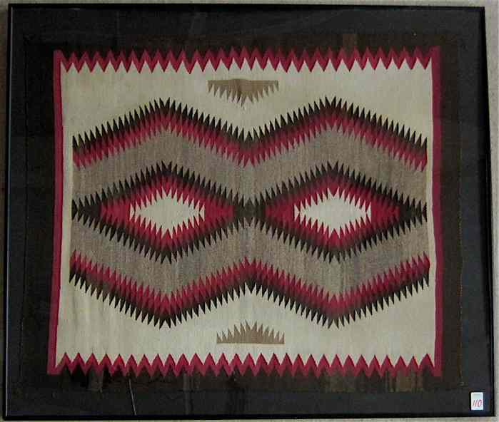 Appraisal: FRAMED NAVAJO RUG Ganado Region hand woven in a serrated