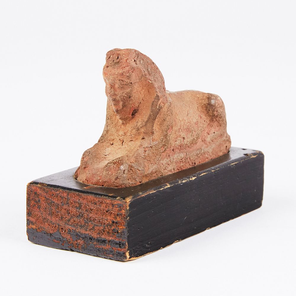 Appraisal: Early Egyptian Ceramic Sphinx Ptolemaic Period Early Egyptian ceramic sphinx