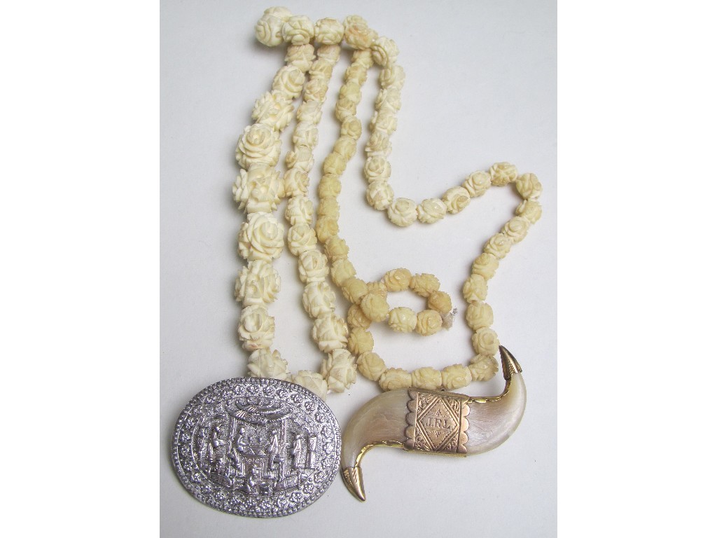 Appraisal: Lot comprising a string of carved ivory beads a highly