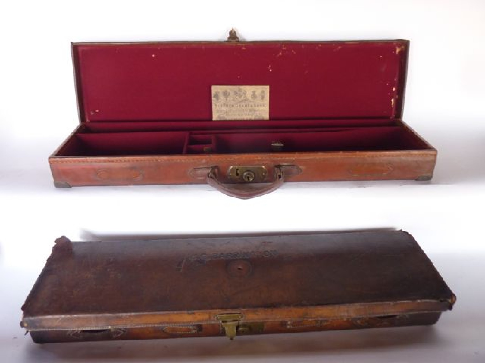 Appraisal: A stitched and tanned leather clad antique shotgun case with