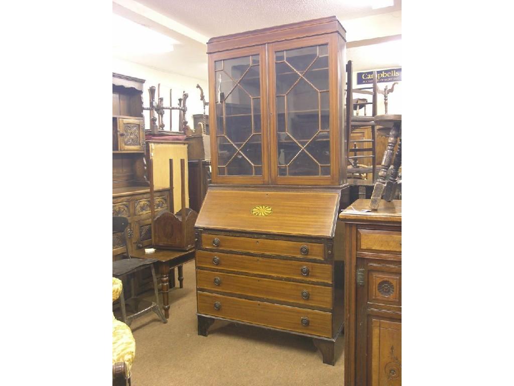 Appraisal: An Edwardian inlaid mahogany bureau bookcase upper stage with three