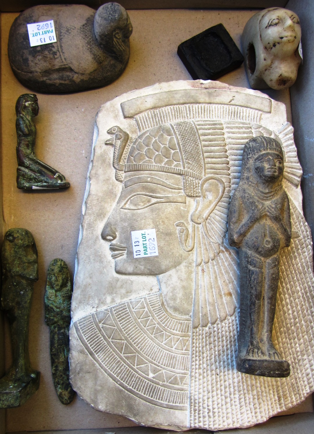 Appraisal: A group of Egyptian-style objects including a limestone relief fragment