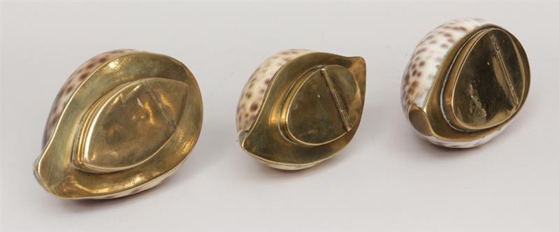 Appraisal: Group of Three Brass-Mounted Cowrie Shell Snuff Boxes in Estimate