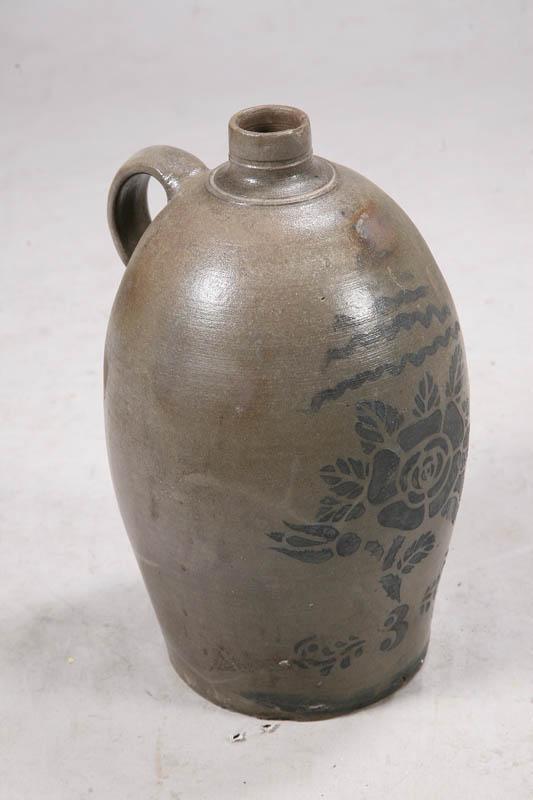 Appraisal: STONEWARE JUG Ovoid shaped with stenciled floral decoration and the