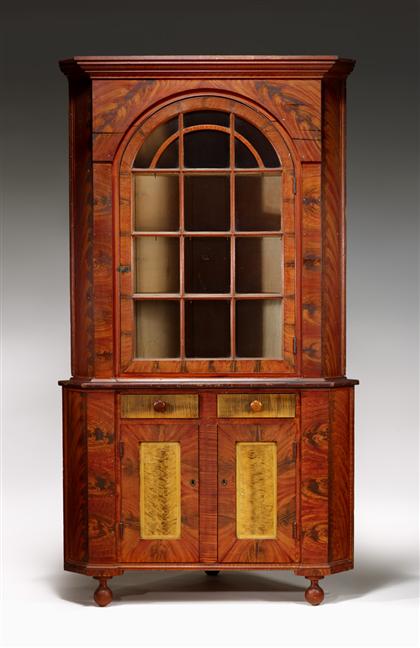 Appraisal: Grained and painted cherry corner cupboard pennsylvania circa In two