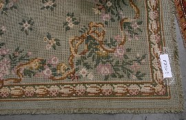 Appraisal: A Portuguese needlework carpet with floral field on an eau