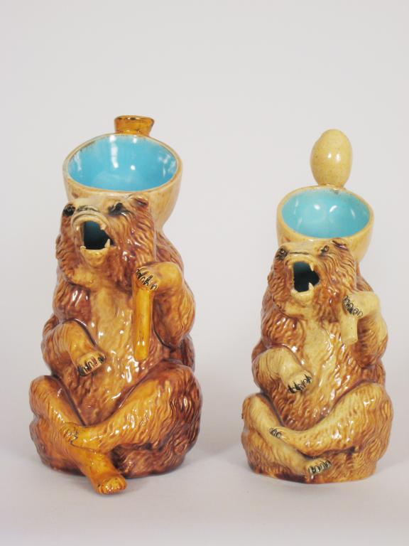 Appraisal: Two majolica Jugs in the form of seated bears with