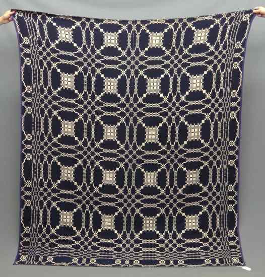 Appraisal: Jacquard blue and white coverlet '' x ''