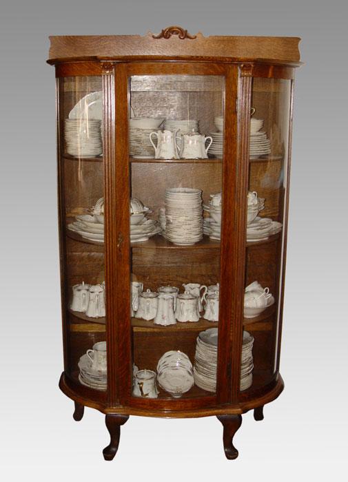 Appraisal: OAK CARVED BOWFRONT CHINA CABINET '' x '' x ''