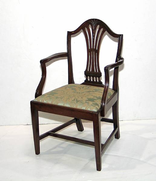 Appraisal: A George III mahogany armchair together with a shield back