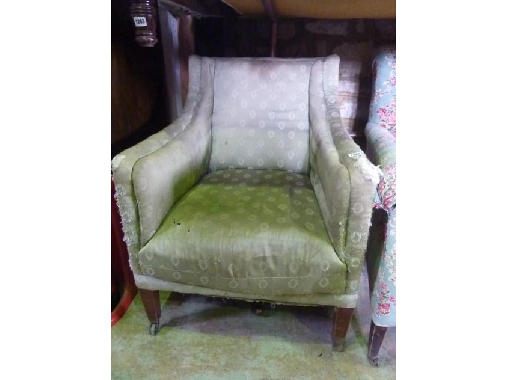 Appraisal: An Edwardian mahogany armchair with shaped outline green ground upholstered