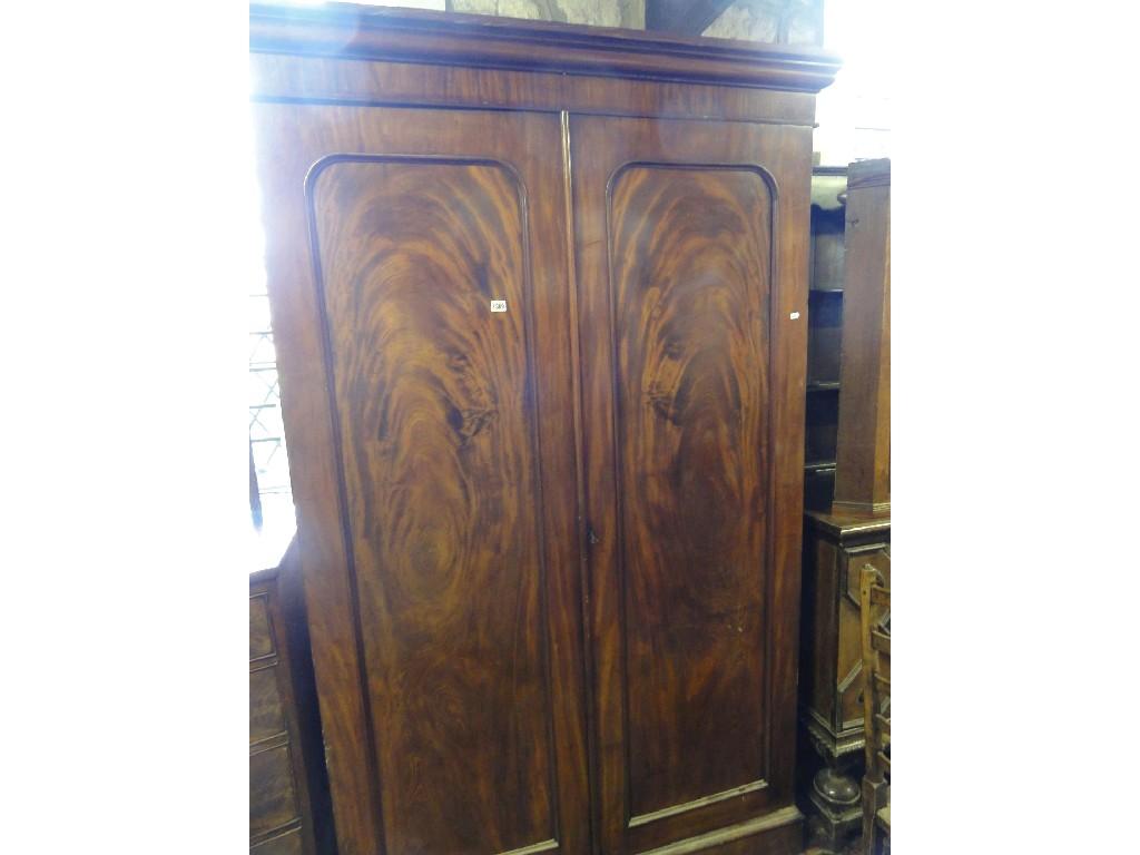 Appraisal: A Victorian mahogany wardrobe enclosed by two panelled doors