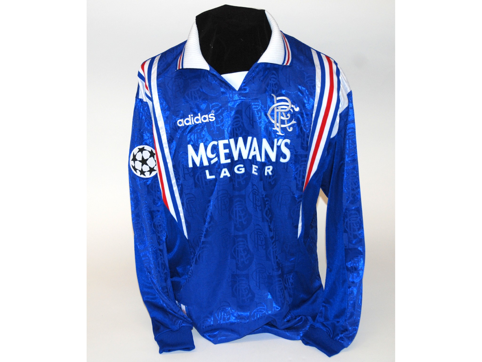 Appraisal: A blue Rangers shirtNo with v-neck collar and embroidered badge