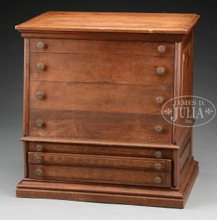 Appraisal: SEVEN-DRAWER WALNUT VICTORIAN SPOOL CABINET Canted front having wide drawers