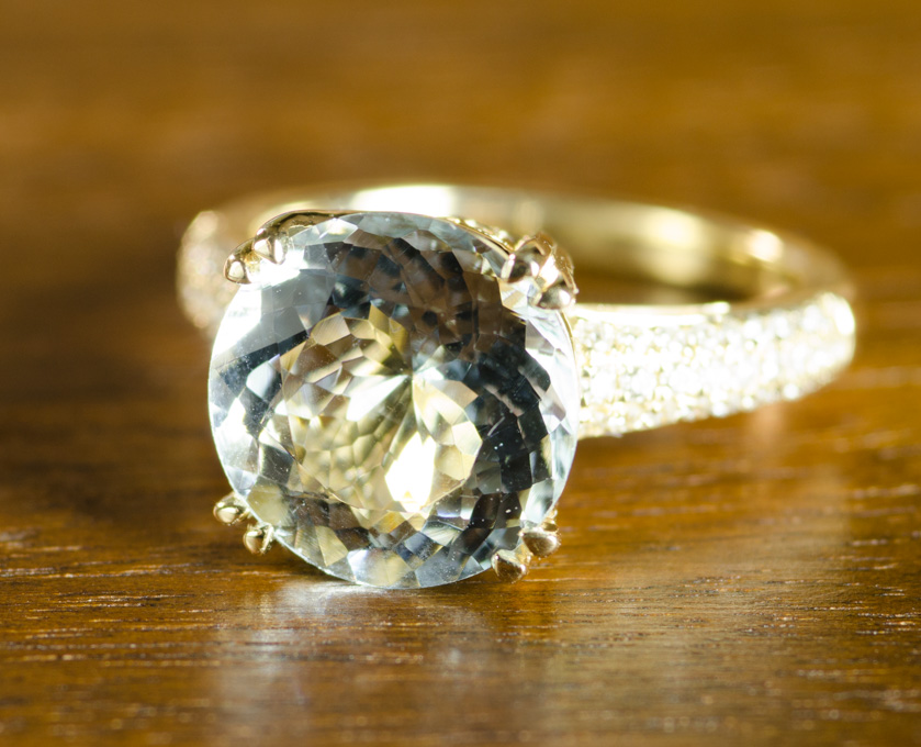 Appraisal: AQUAMARINE DIAMOND AND FOURTEEN KARAT GOLD RING with round-cut diamonds