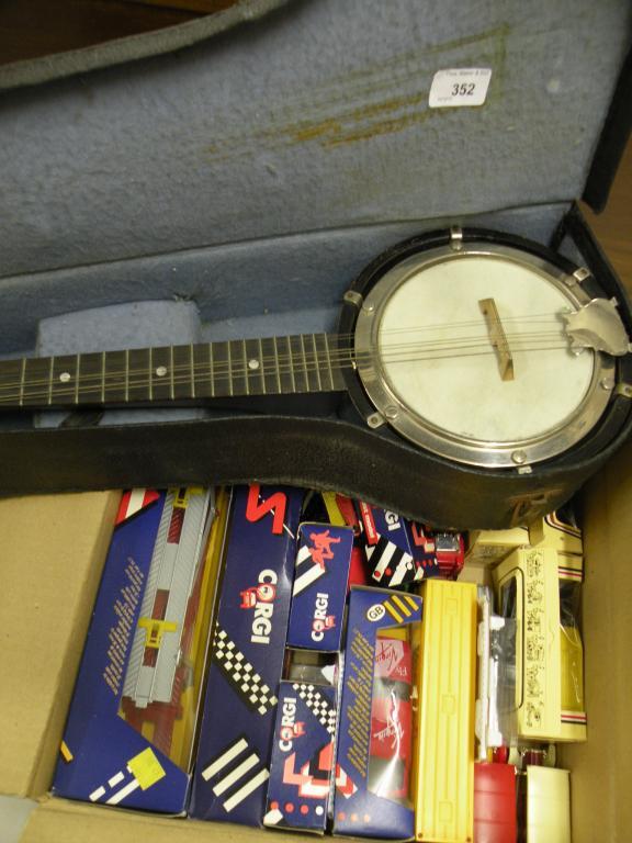 Appraisal: A banjolele in fitted case and various Corgi and other