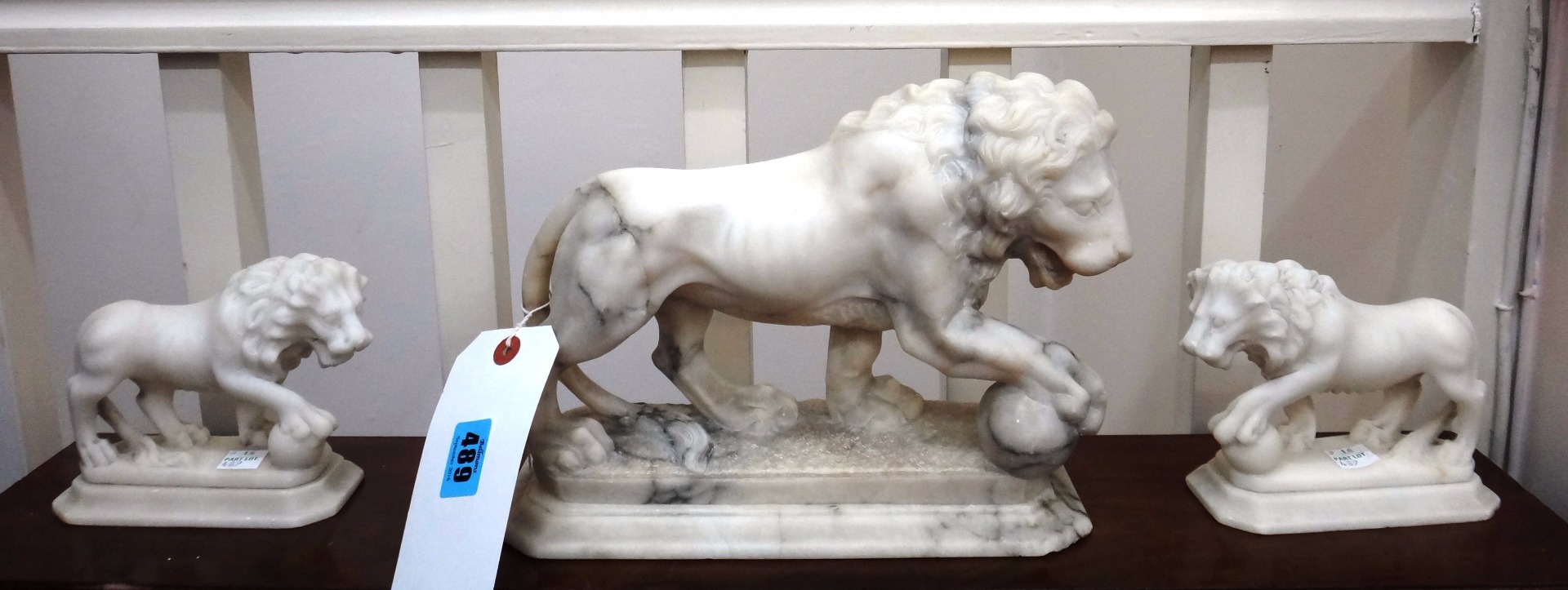 Appraisal: A white veined marble figure of a lion probably late