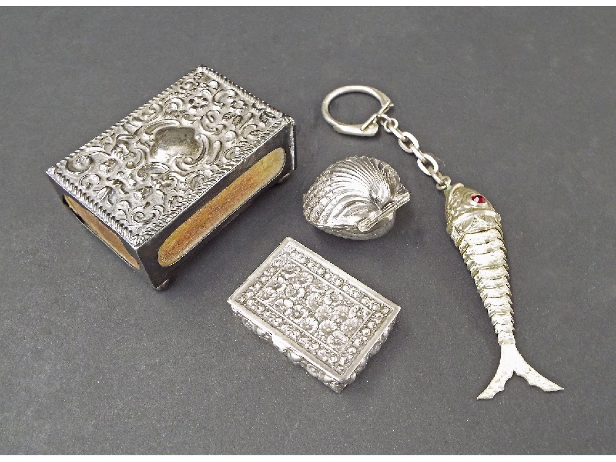 Appraisal: Edwardian silver vesta case the top embossed with scrolled foliage