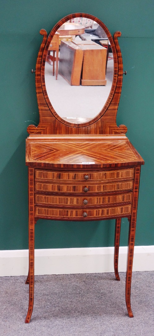 Appraisal: A small th century coromandel dressing table with oval swing