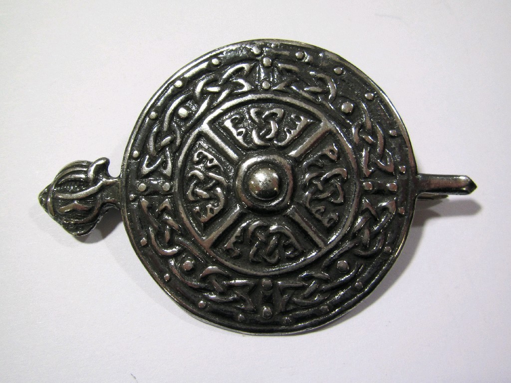 Appraisal: Alexander Ritchie silver sword and shield brooch with knotwork panels