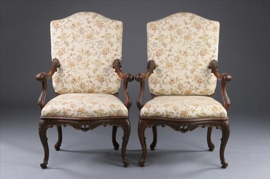 Appraisal: PAIR CONTINENTAL WALNUT FAUTEUILS th century Serpentine padded back above