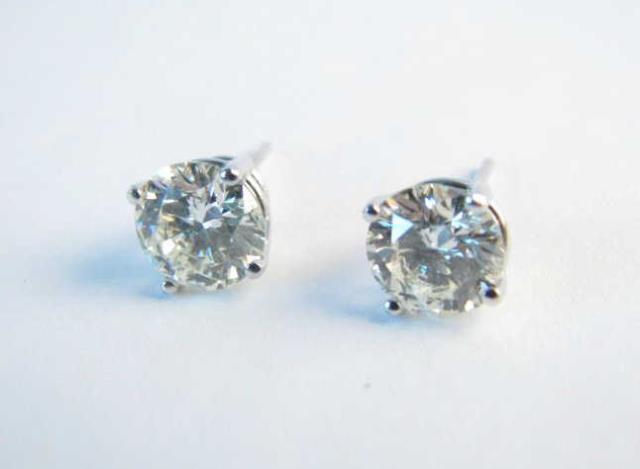 Appraisal: A pair of K white gold mounted ctw round diamond