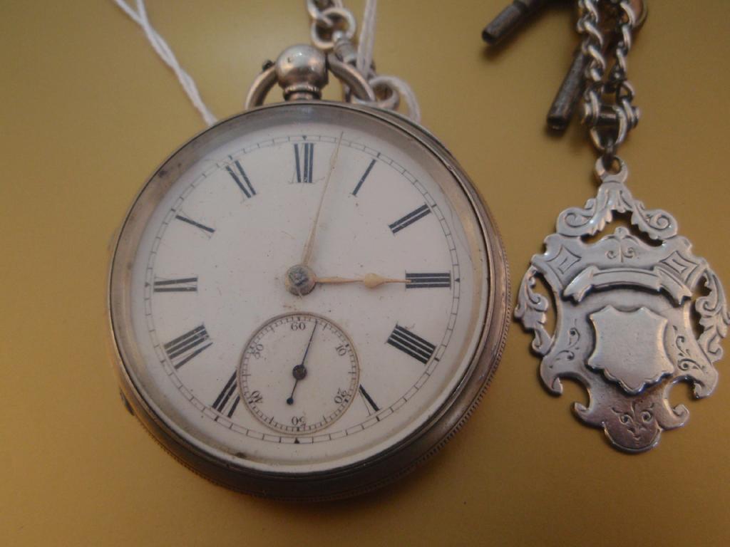 Appraisal: An open faced silver pocket watch and Albert with fob