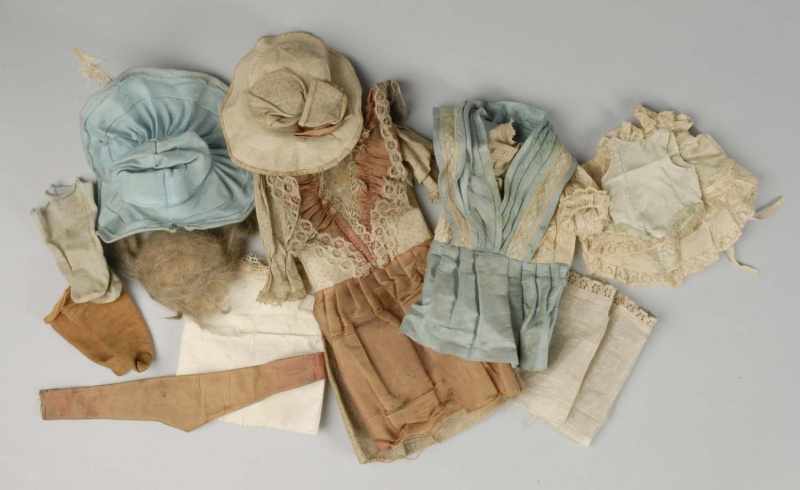 Appraisal: Large Lot of Vintage and Antique Doll Clothing Description Blue