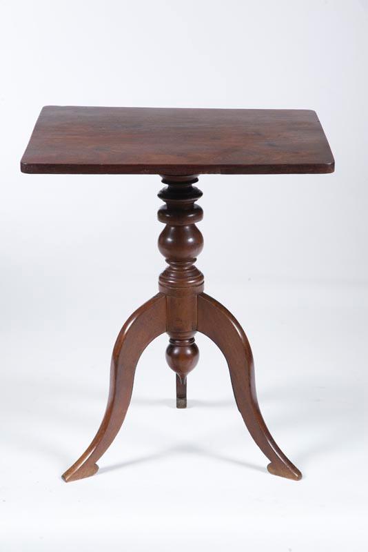 Appraisal: FOLKSY CANDLESTAND American early th century mahogany Square top over