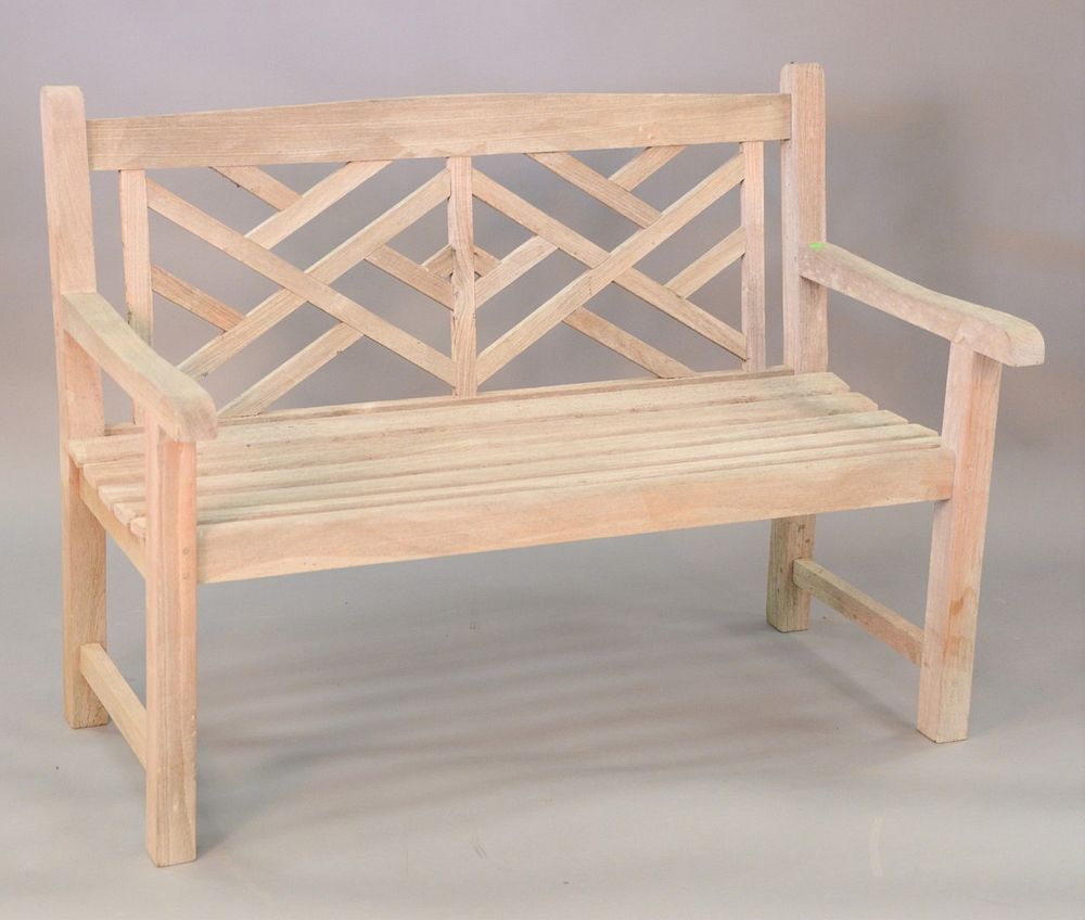 Appraisal: Teak bench with geometric back ht wd Teak bench with