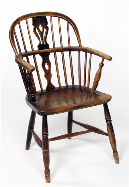 Appraisal: A mid th century yew wood and elm Windsor chair