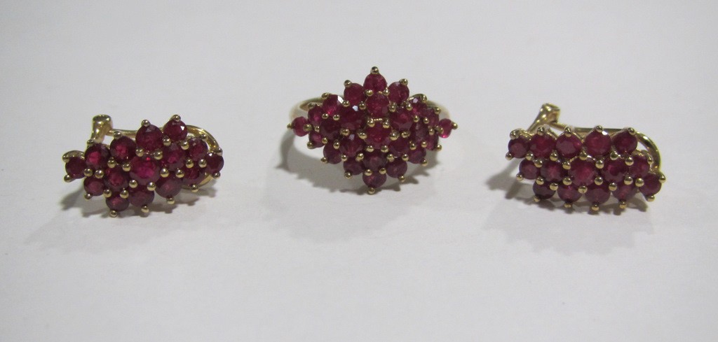 Appraisal: Nine carat gold ruby cluster ring with a pair of