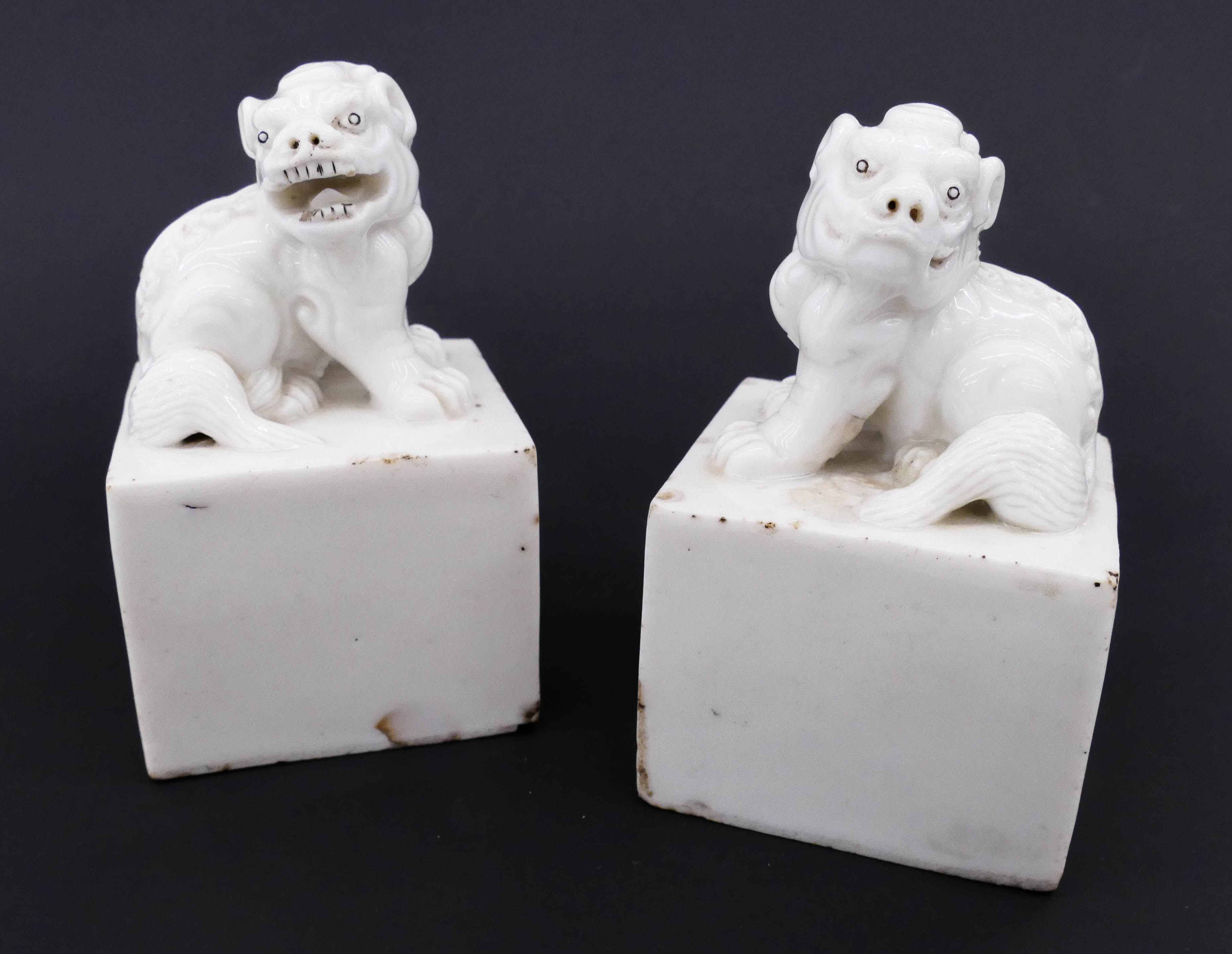 Appraisal: Pair Chinese Qing Dehua Foo Lion Seals ''x '' A