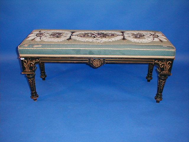 Appraisal: A Victorian ebonised duet stool with floral panel bead work