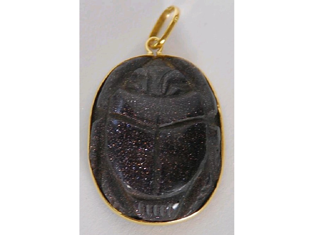 Appraisal: CARVED DARK AVENTURINE SCARAB PENDANT with probably Egyptian gold mount