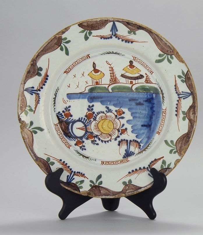 Appraisal: DELFT POTTERY CHARGER Circa With polychrome Oriental landscape decoration on